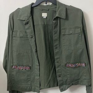 Green jacket with embellish pockets
